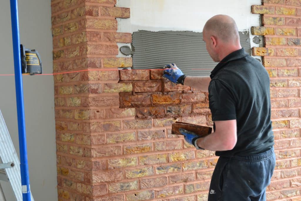 Brick Slips And Brick Tiles being installed by tiler