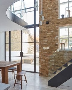 Exposed modern brick tiles feature wall landing