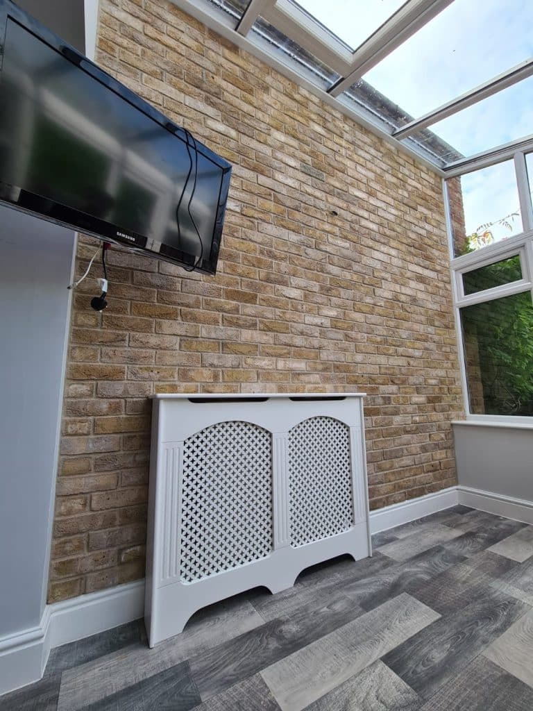 conservatory Mystique feature brick wall